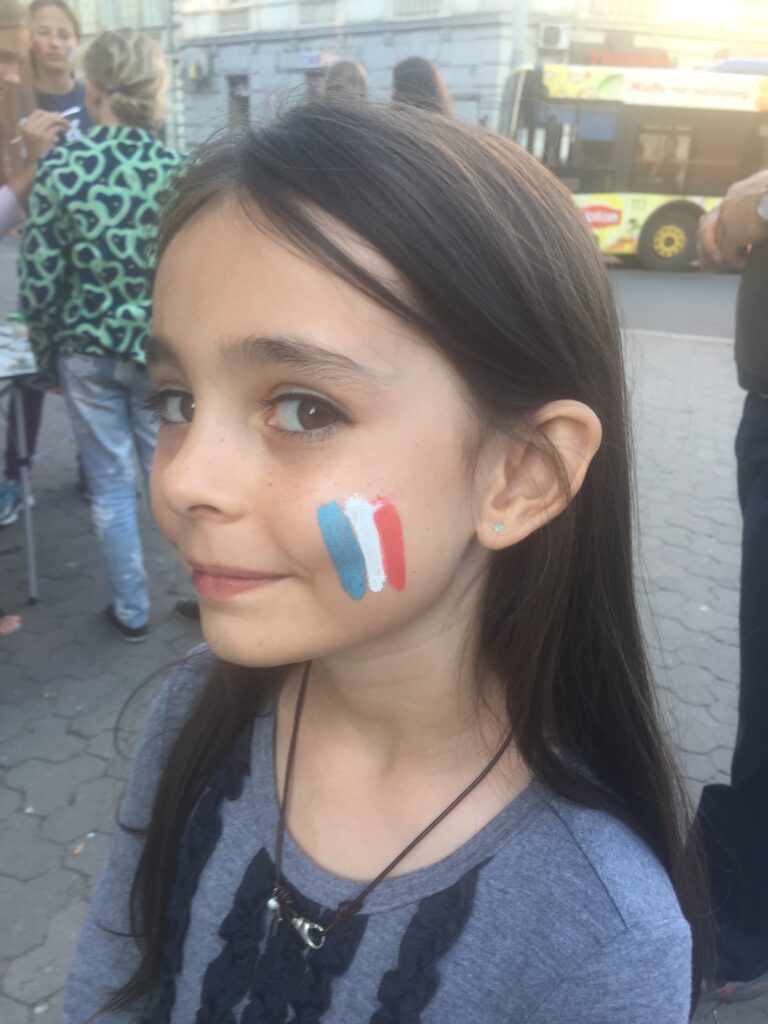 Macy has Ukraine flag painted on face