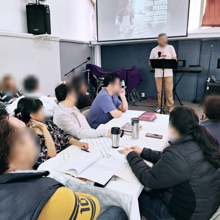 Church leaders at a mission training session (faces blurred)
