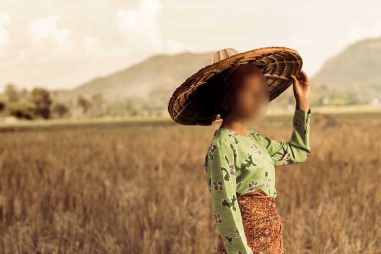 A woman in a rice field in Indonesia (face blurred)